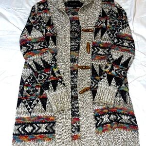 Women’s colorful and stylish button up cardigan with unique wooden buttons.